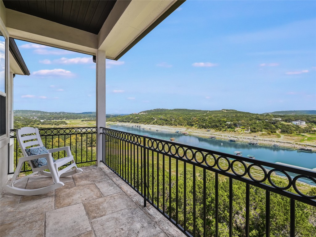 a view of a balcony with an ocean view