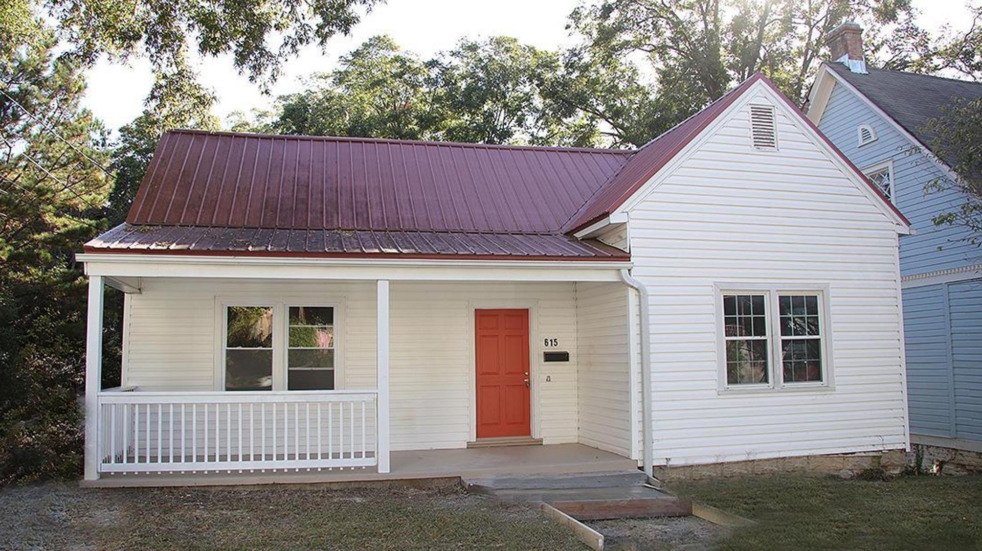 a front view of a house with a yard