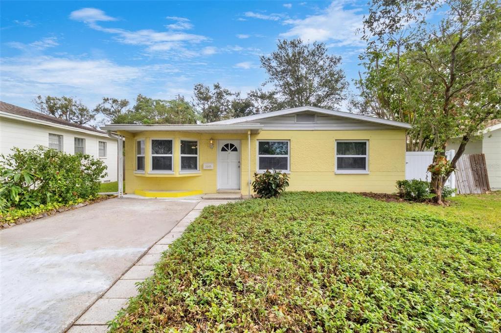 front view of a house with a yard