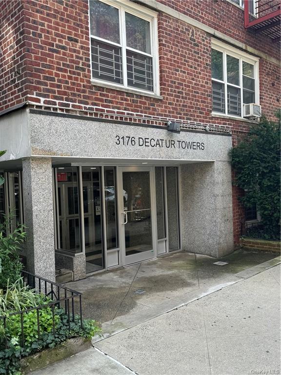 a view of a building with a window and pathway