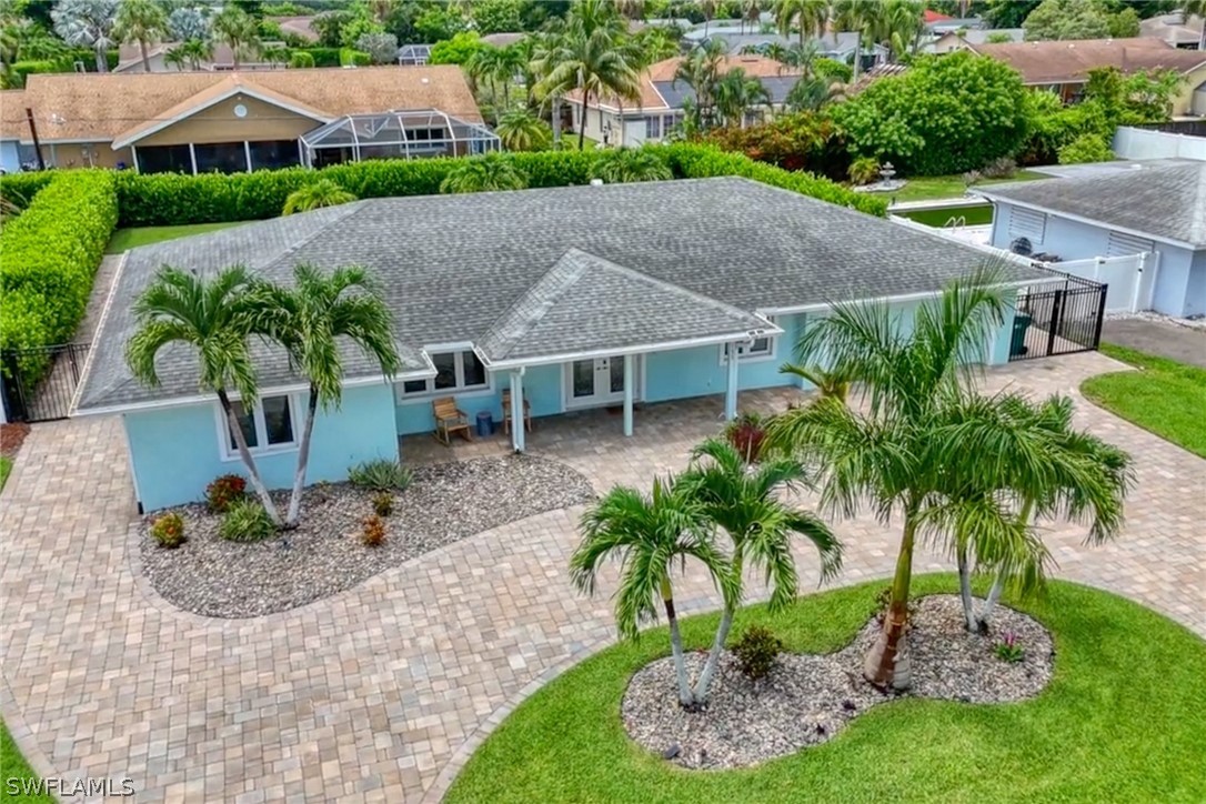 a aerial view of a house with a garden and plants