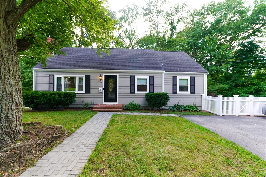 a house view with a garden space