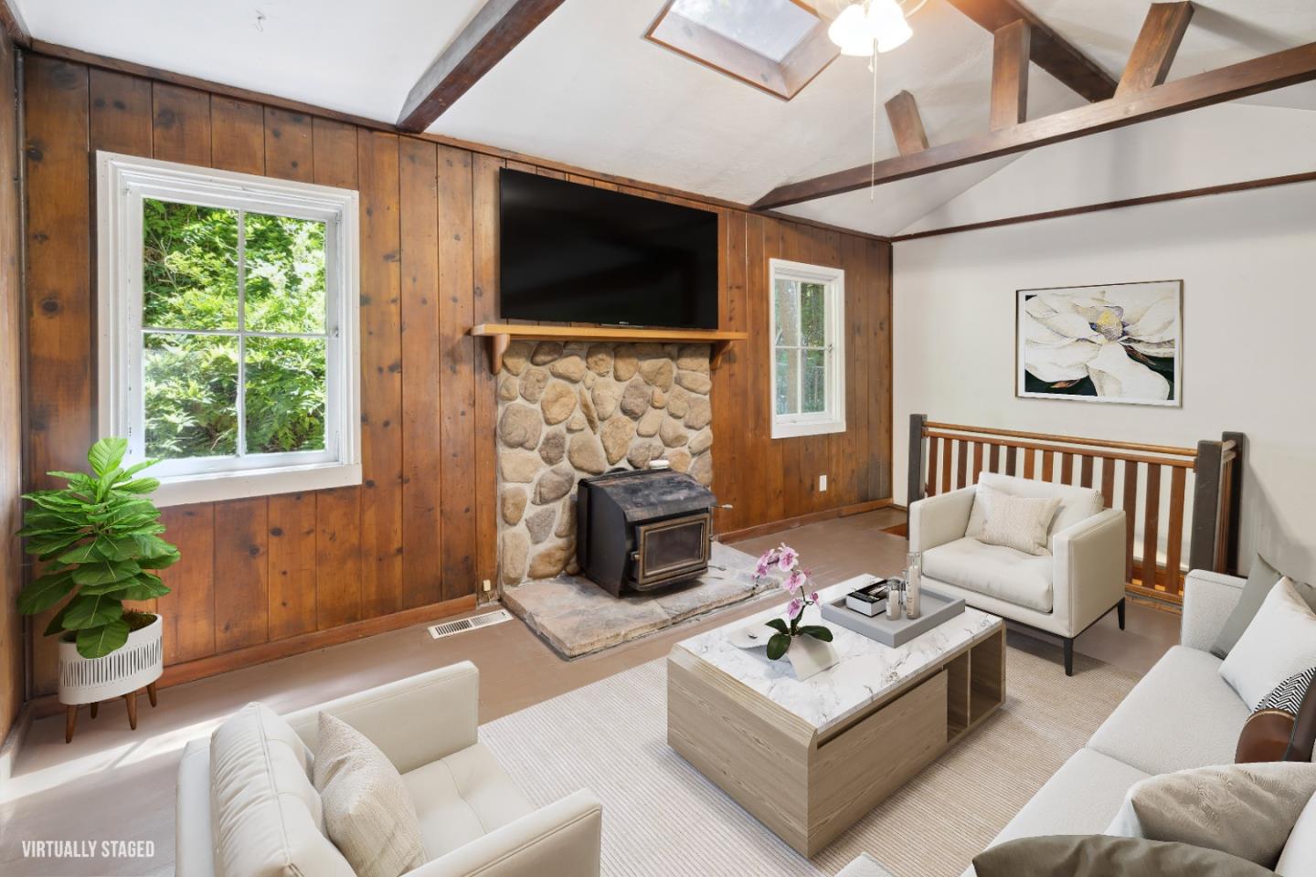 a living room with fireplace furniture and a flat screen tv