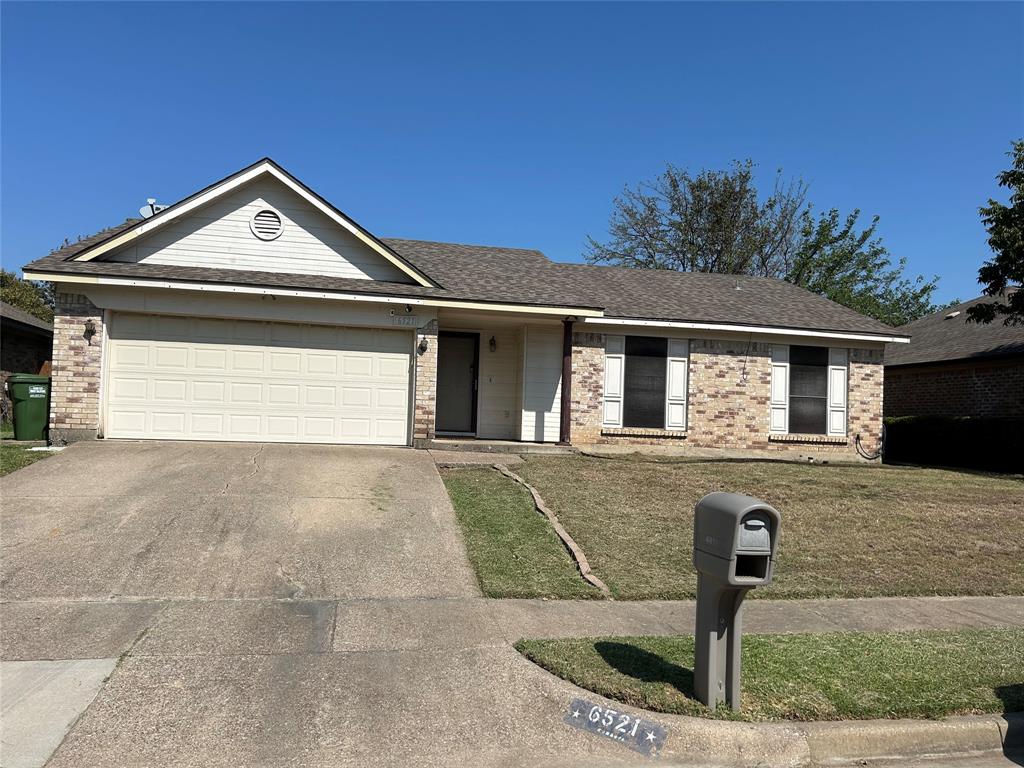 a front view of a house with garage