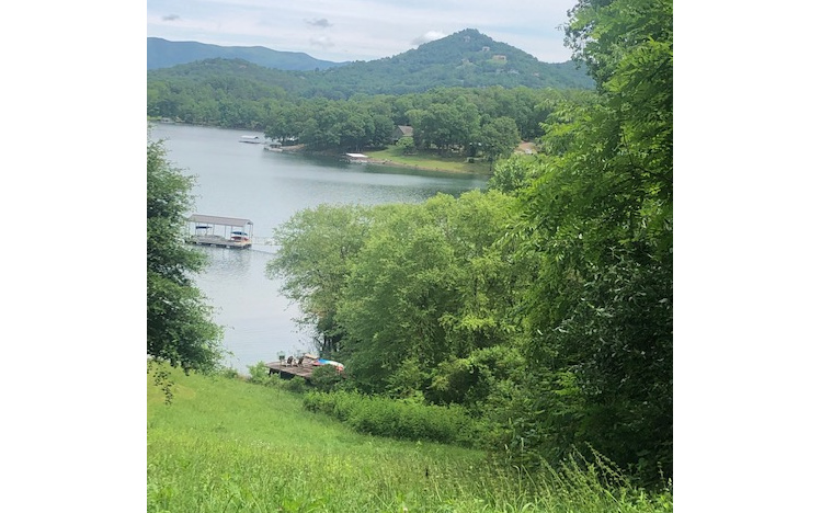 a view of lake with mountain