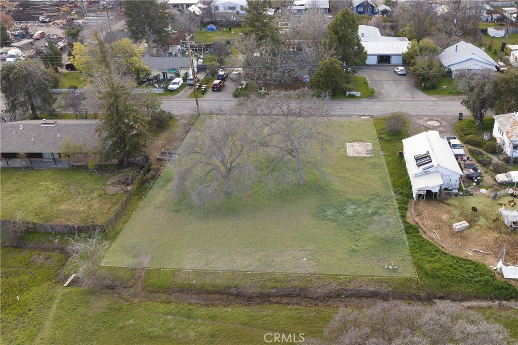 an aerial view of a house with a yard