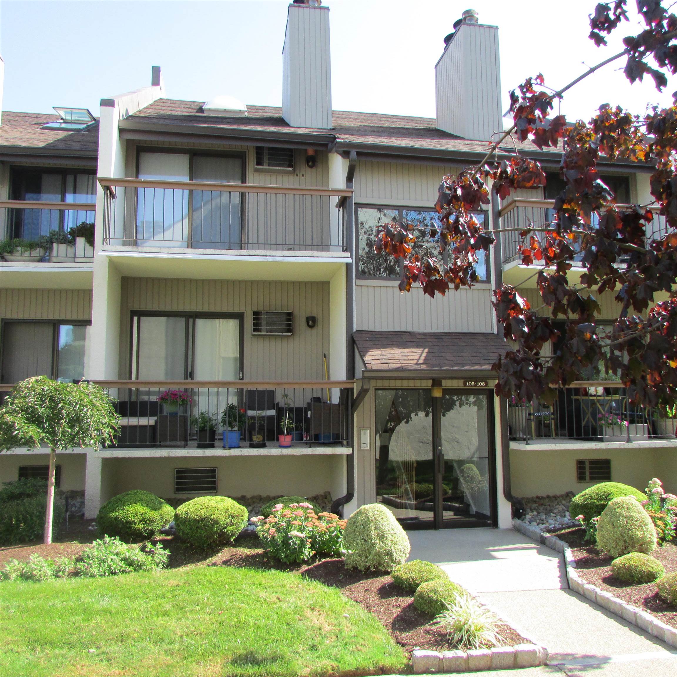 a view of a house with a porch and a fireplace