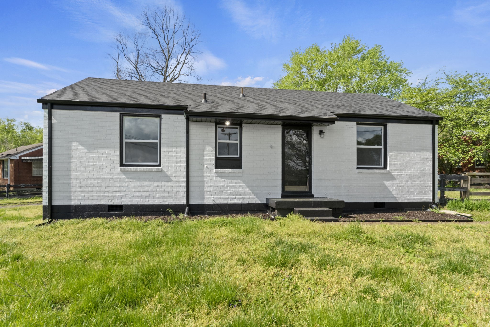 a front view of a house with yard