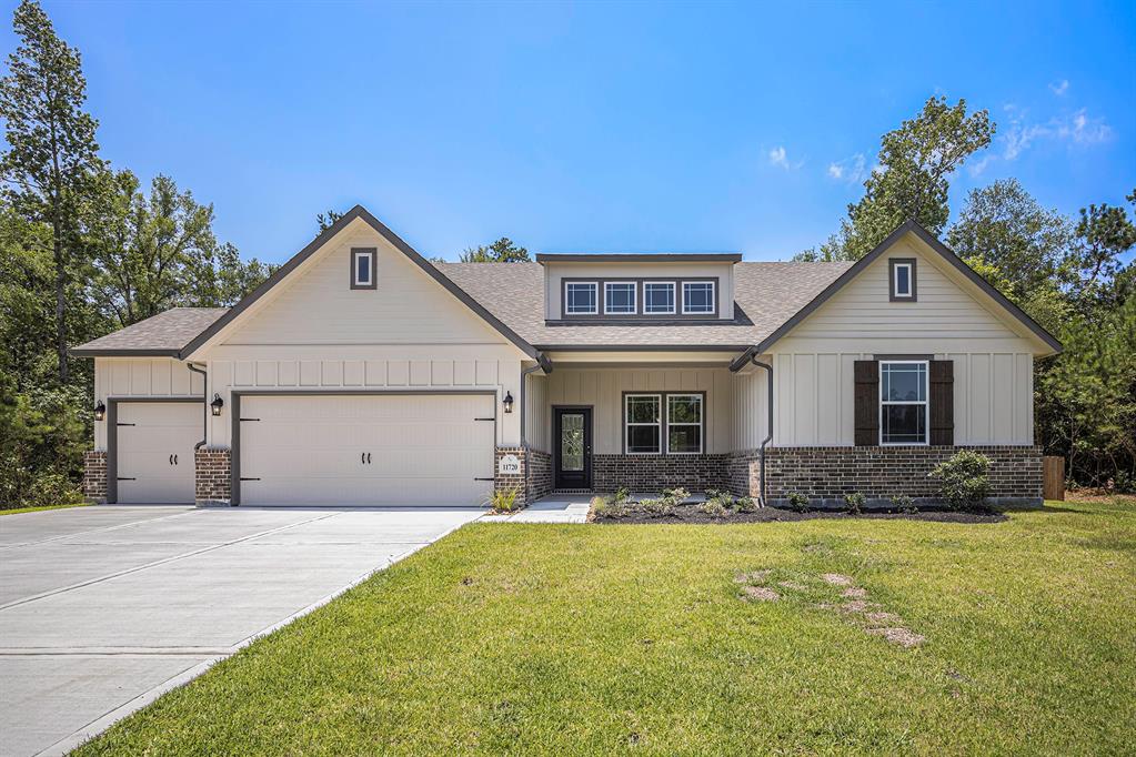 a front view of house with yard outdoor seating and barbeque oven