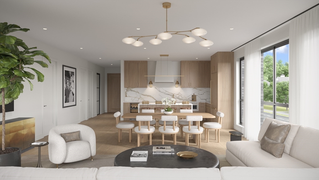 a living room with kitchen island furniture and a chandelier