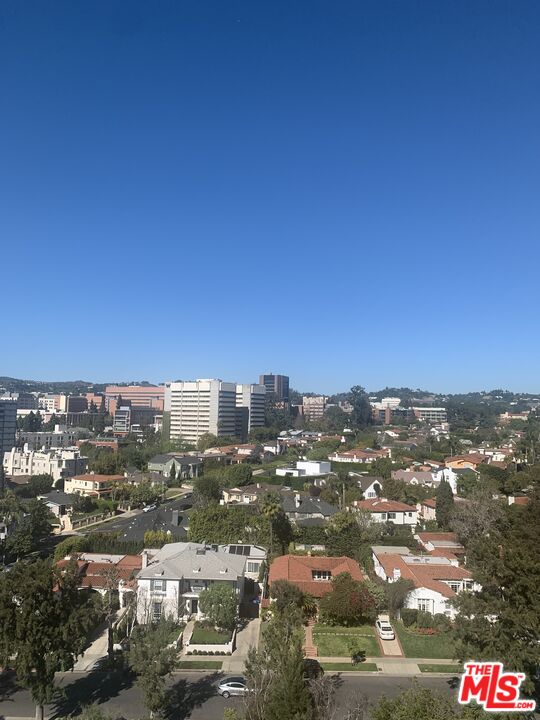 an aerial view of city and green space