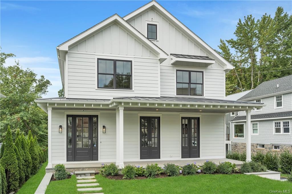 front view of a house with a yard