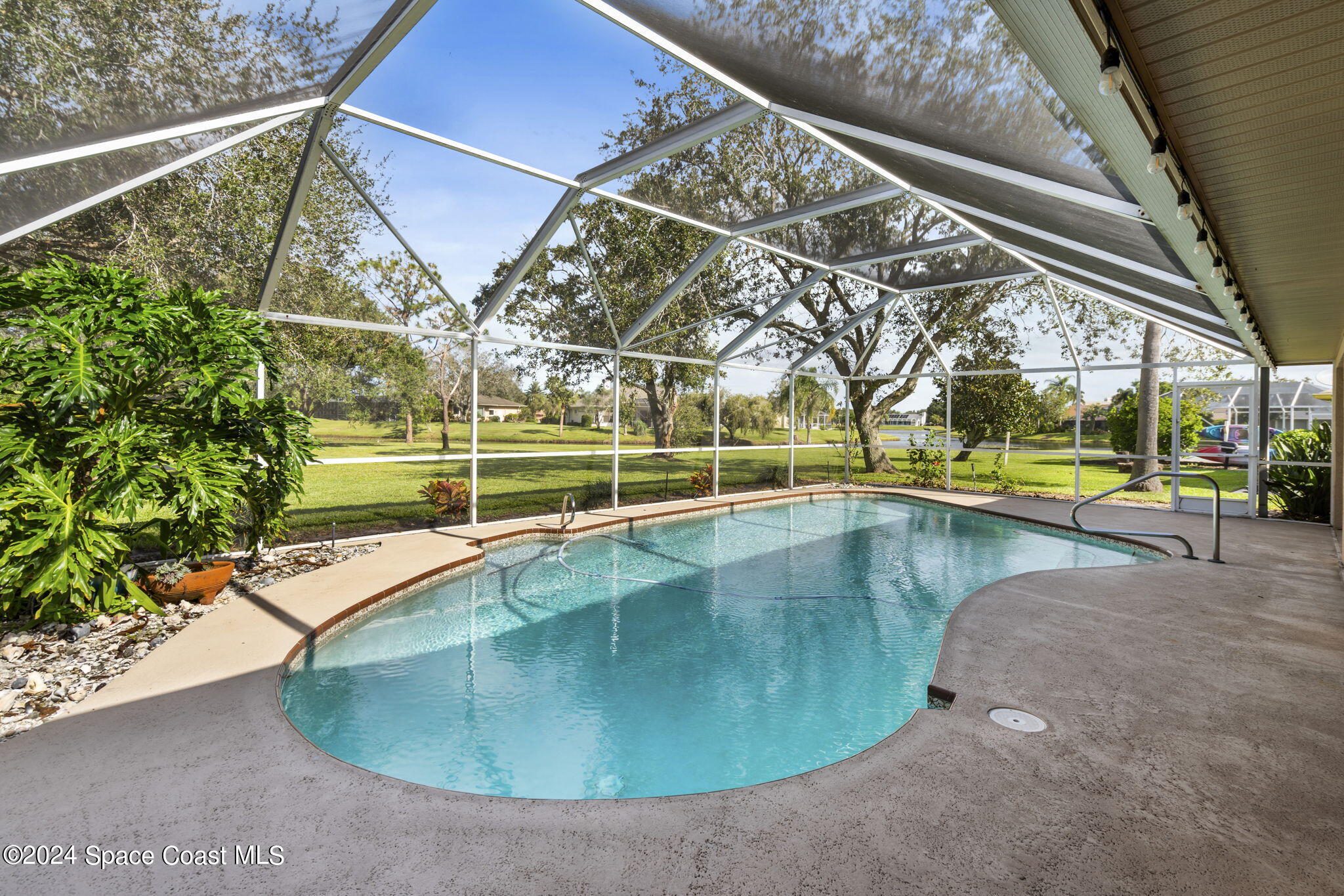 a view of a swimming pool with a porch