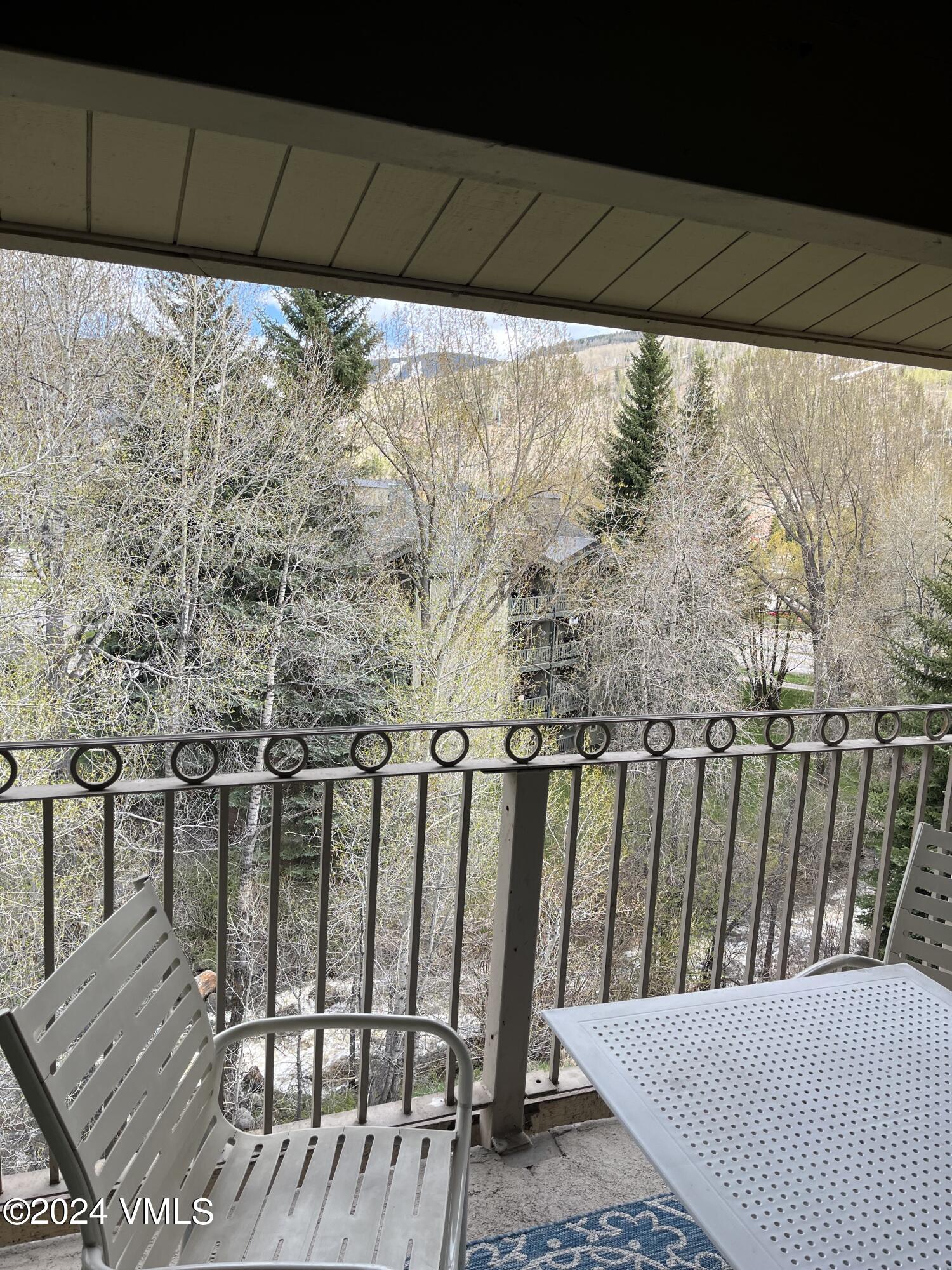 a balcony with wooden floor