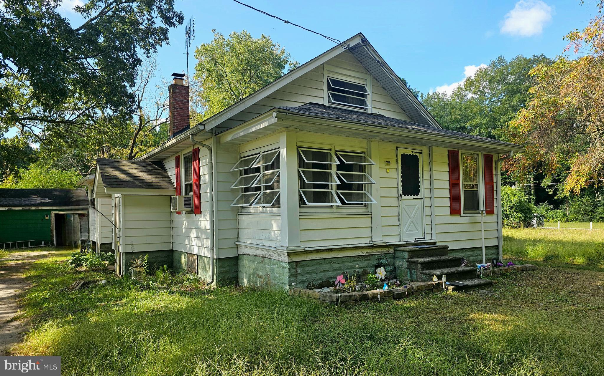 a front view of house with garden