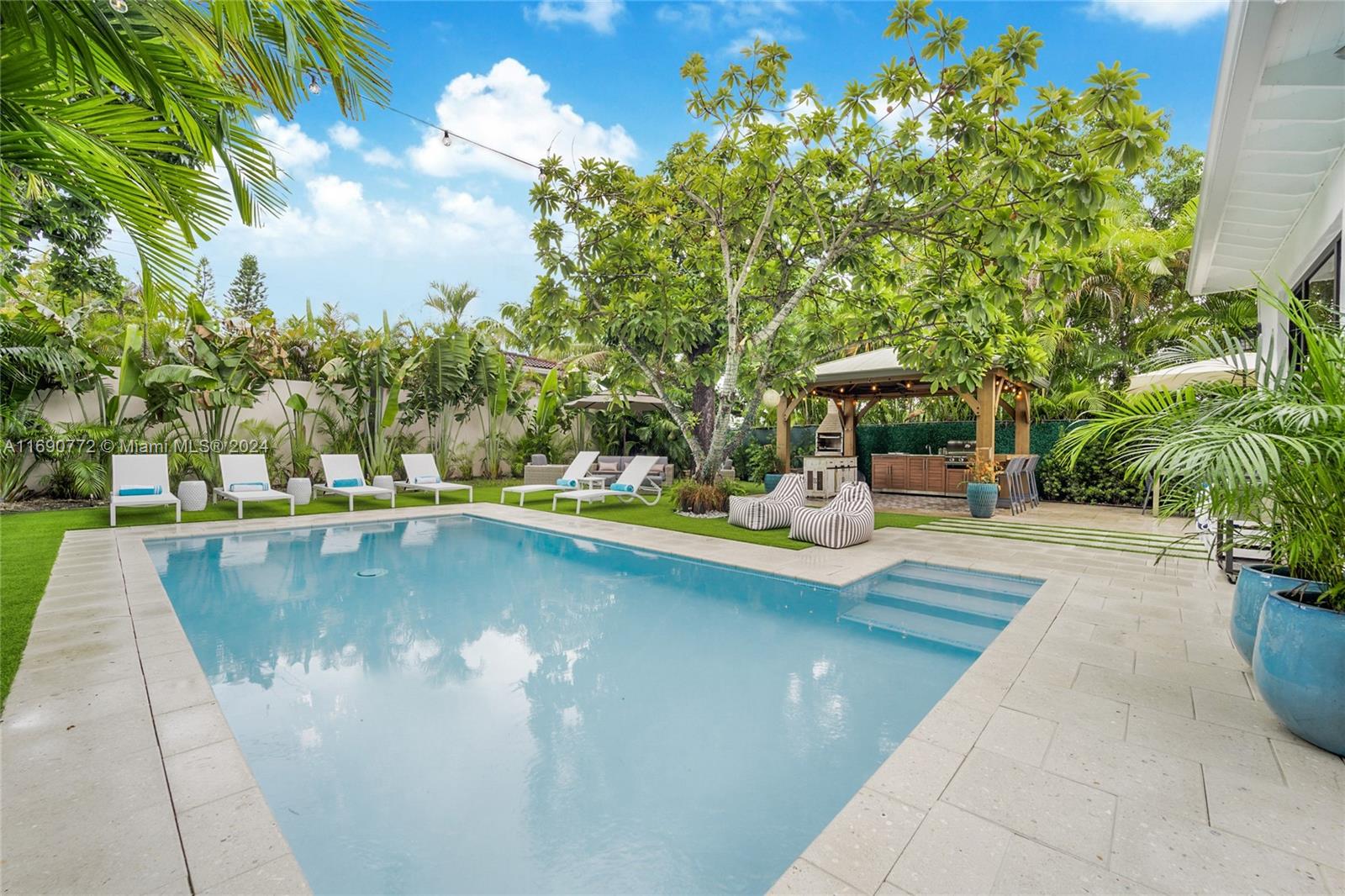 a view of a swimming pool with a patio