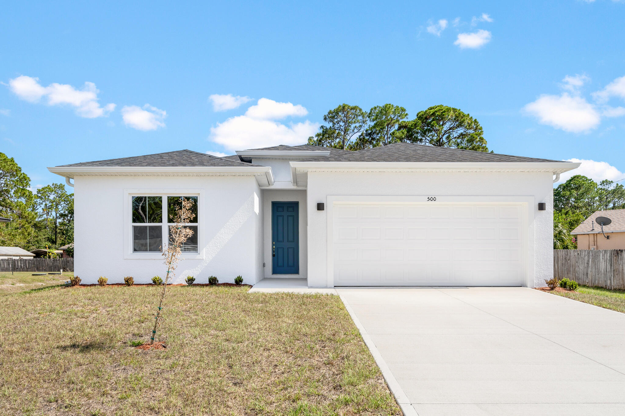 front view of a house with a yard