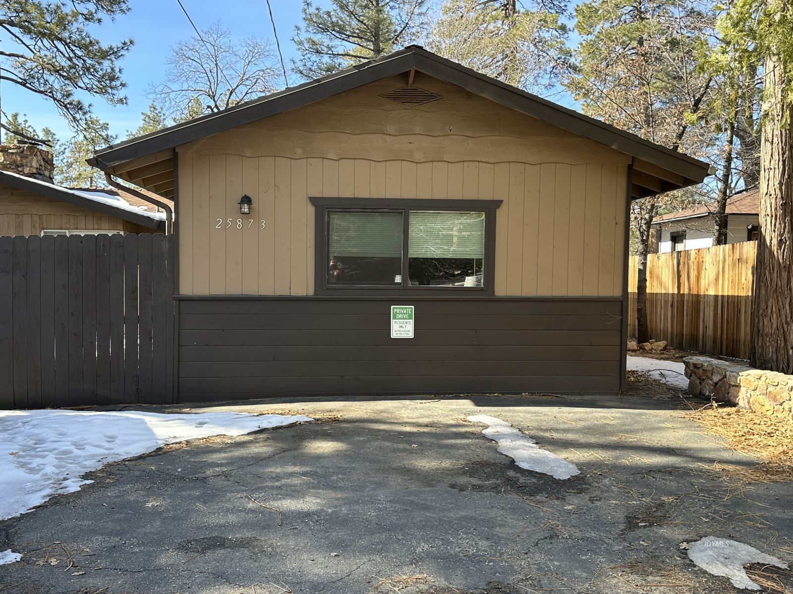 a front view of a house with garage