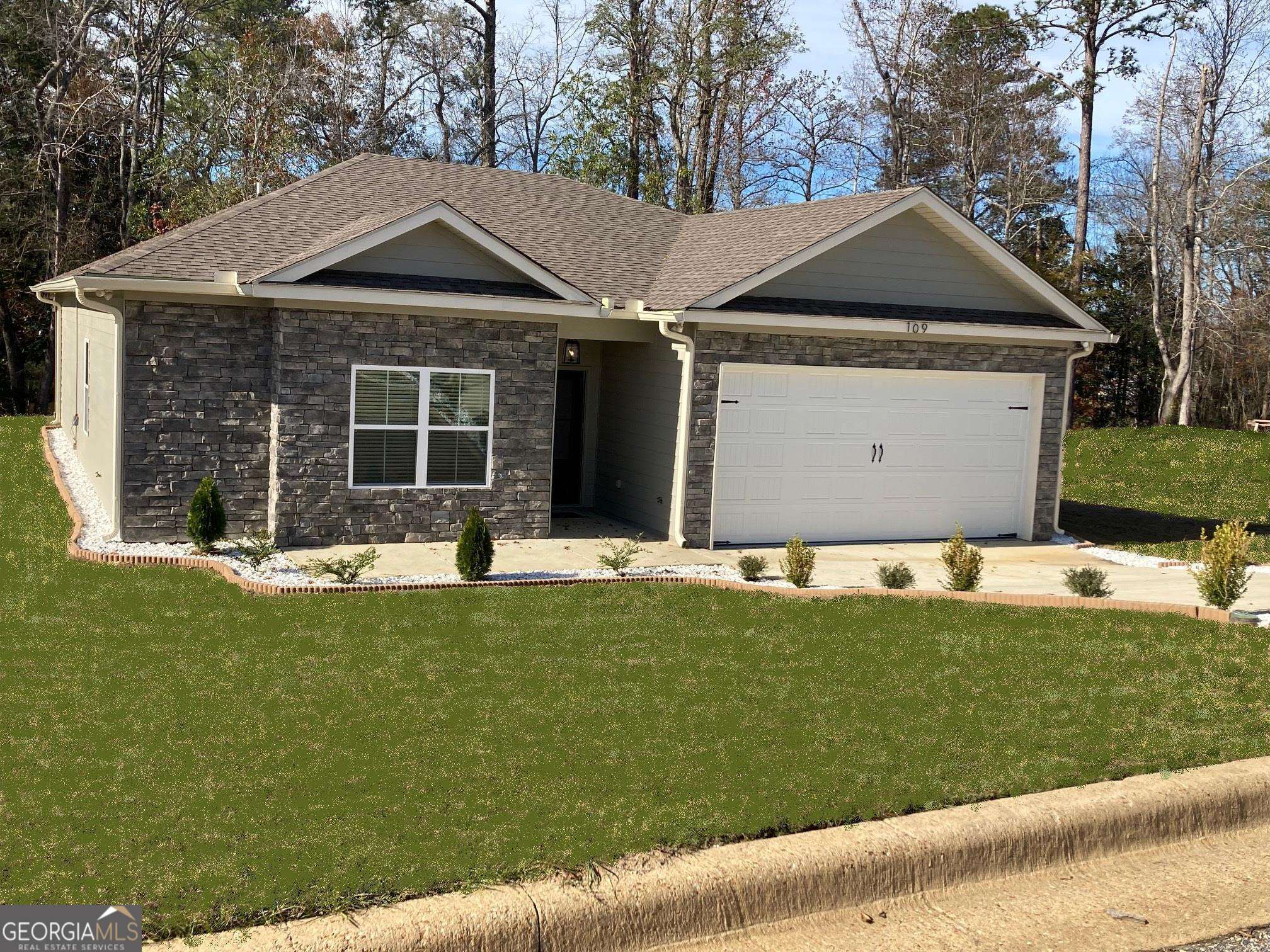 a front view of a house with a yard