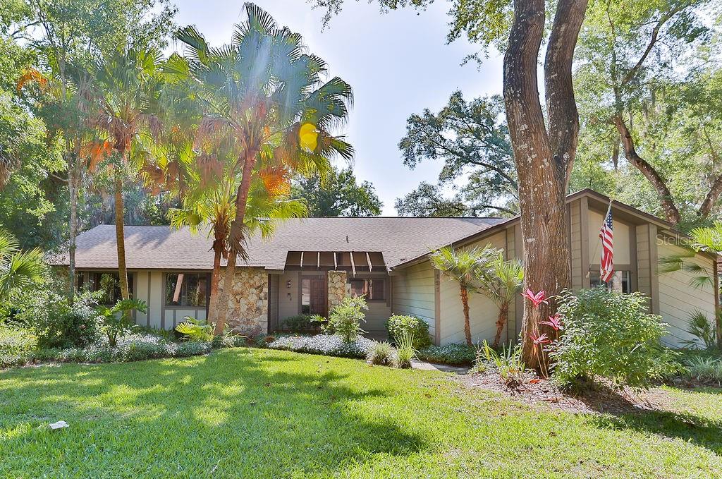 front view of a house with a yard