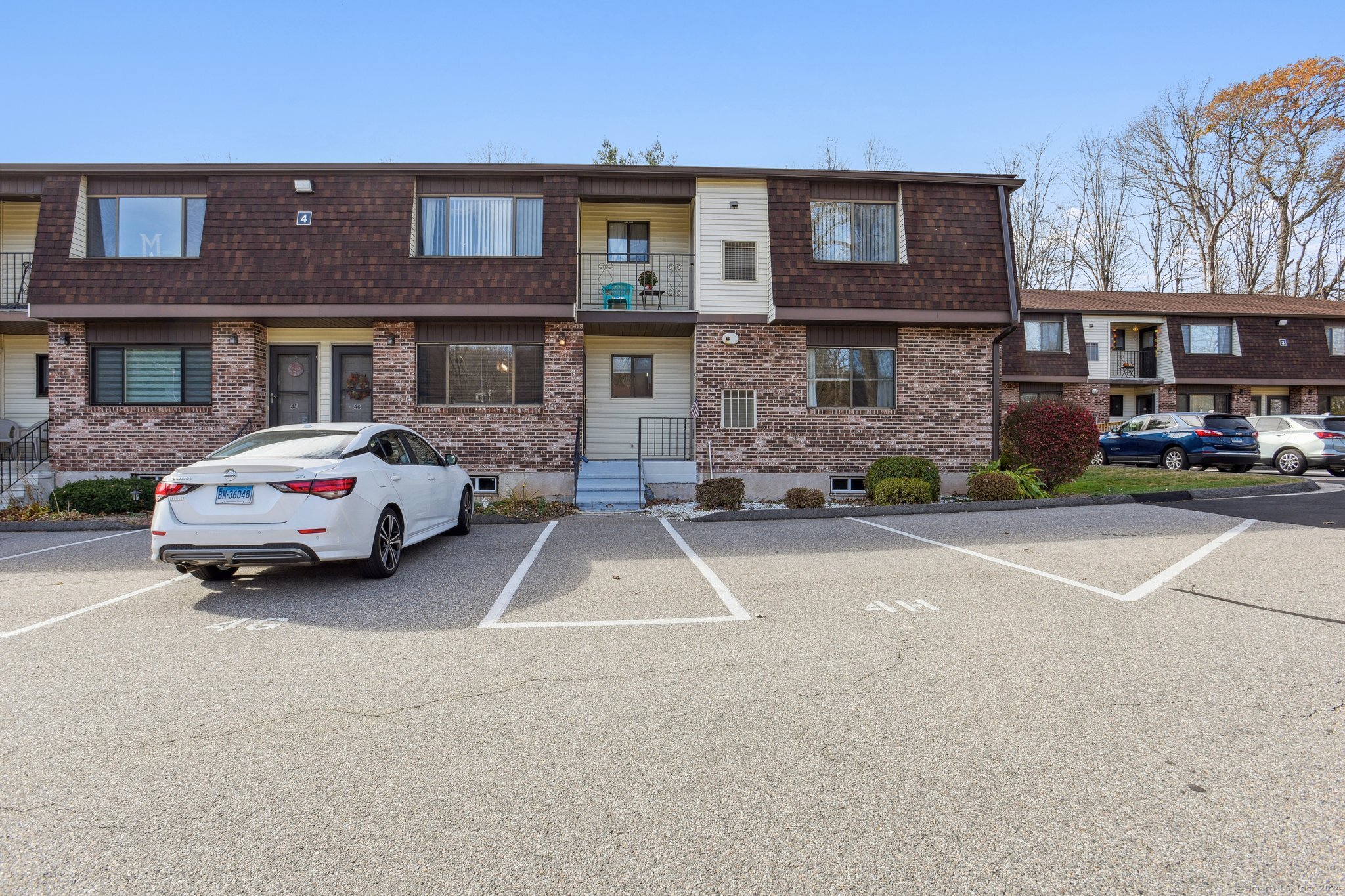 a car parked in front of a brick building