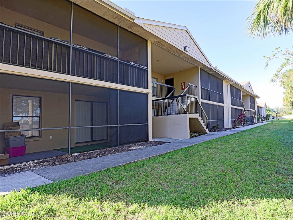 a view of backyard with deck and seating area