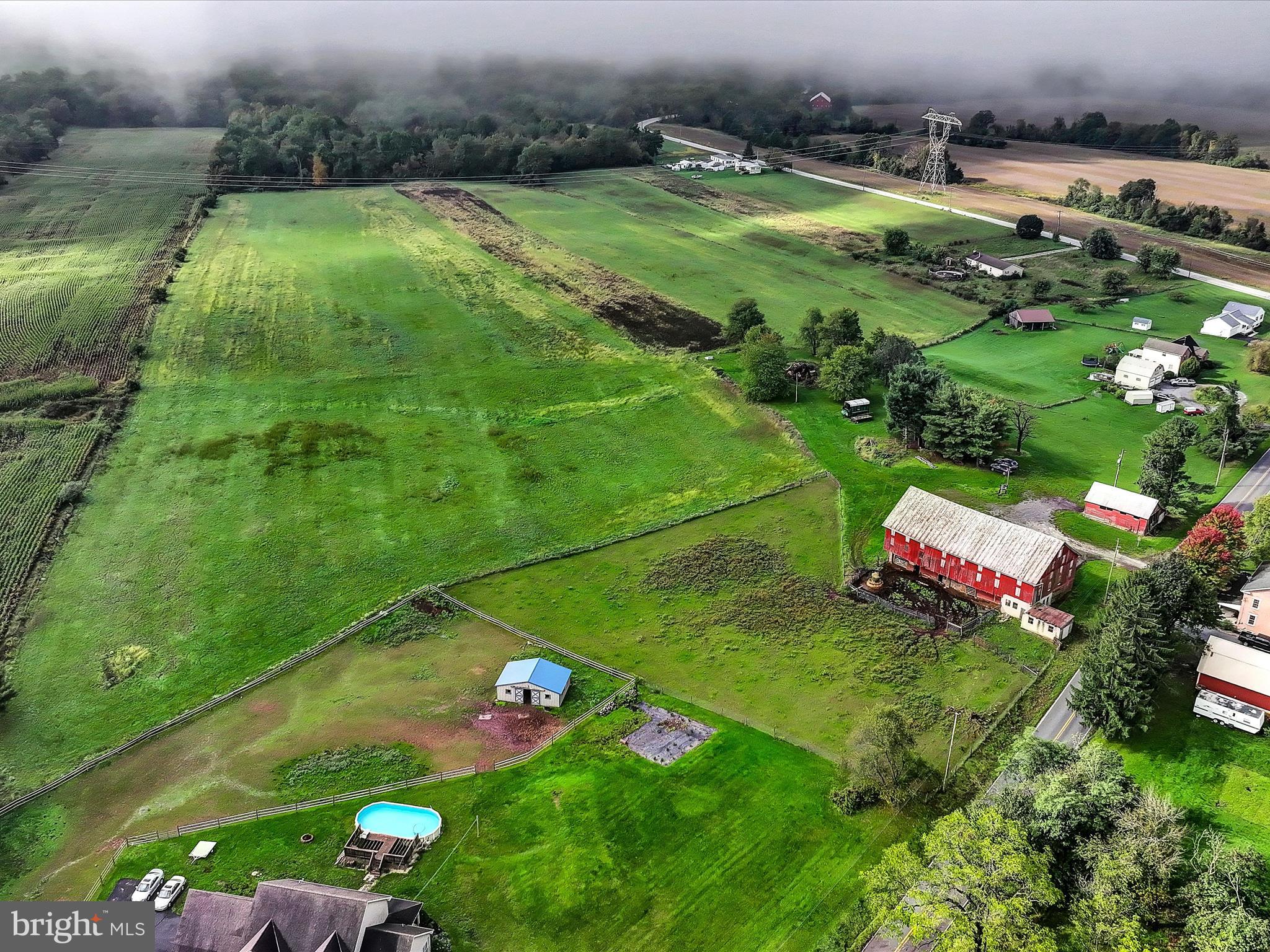 an aerial view of a golf course with parking space