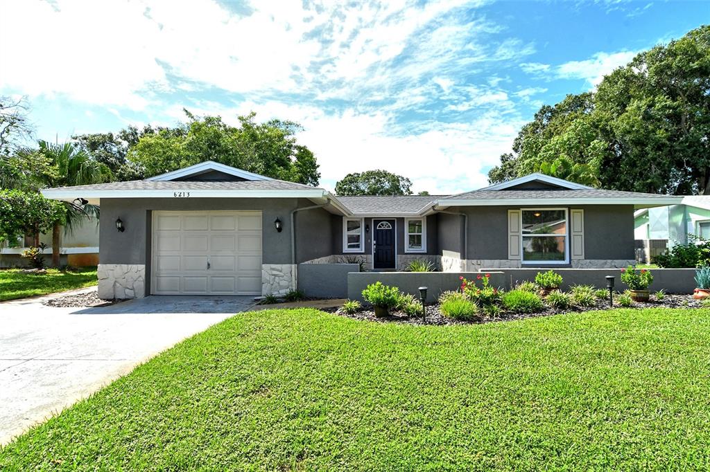 front view of a house with a yard