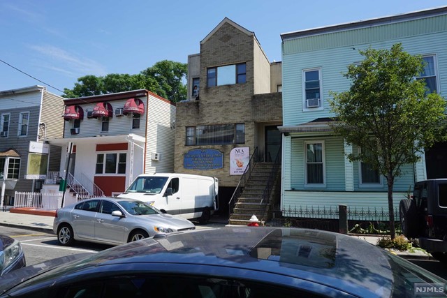 a front view of house with outdoor seating