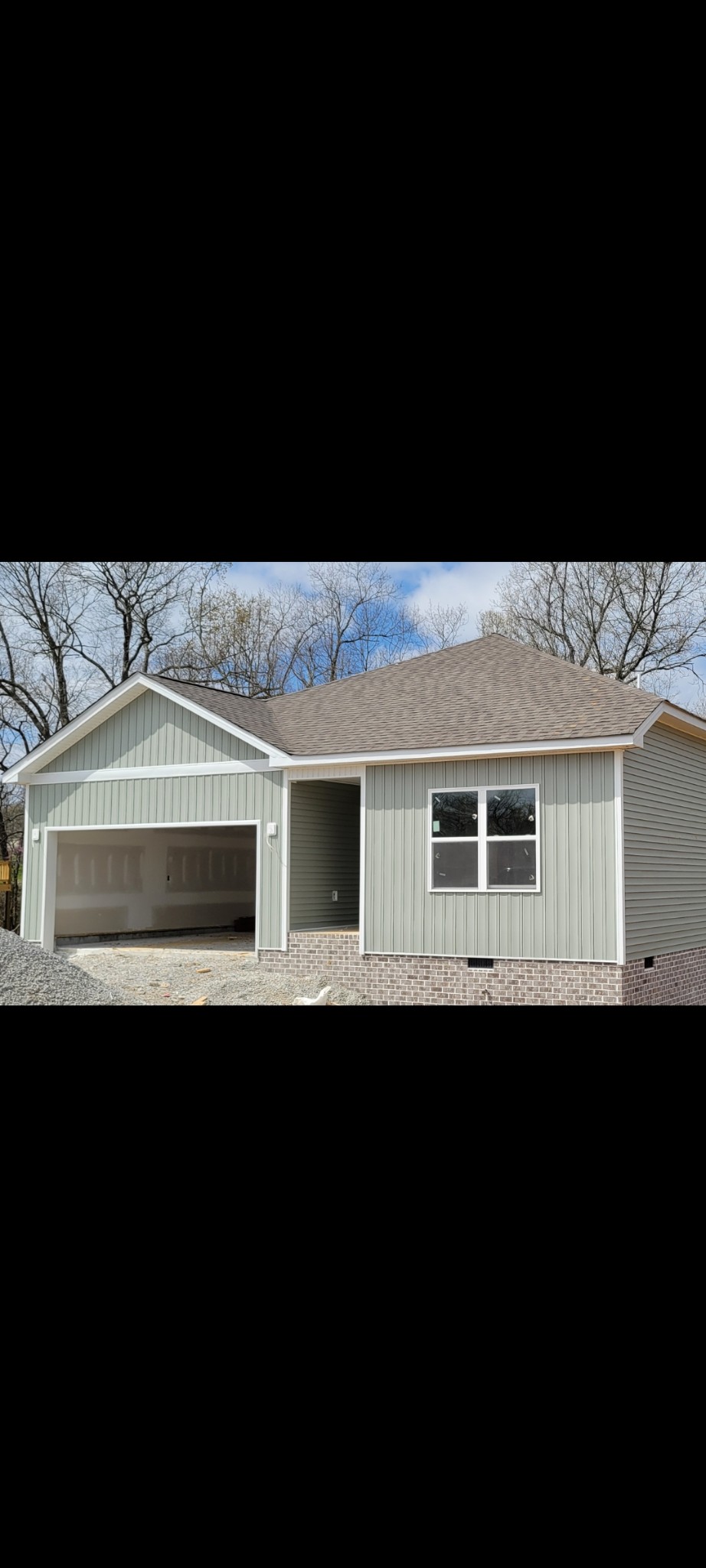 a front view of a house with yard