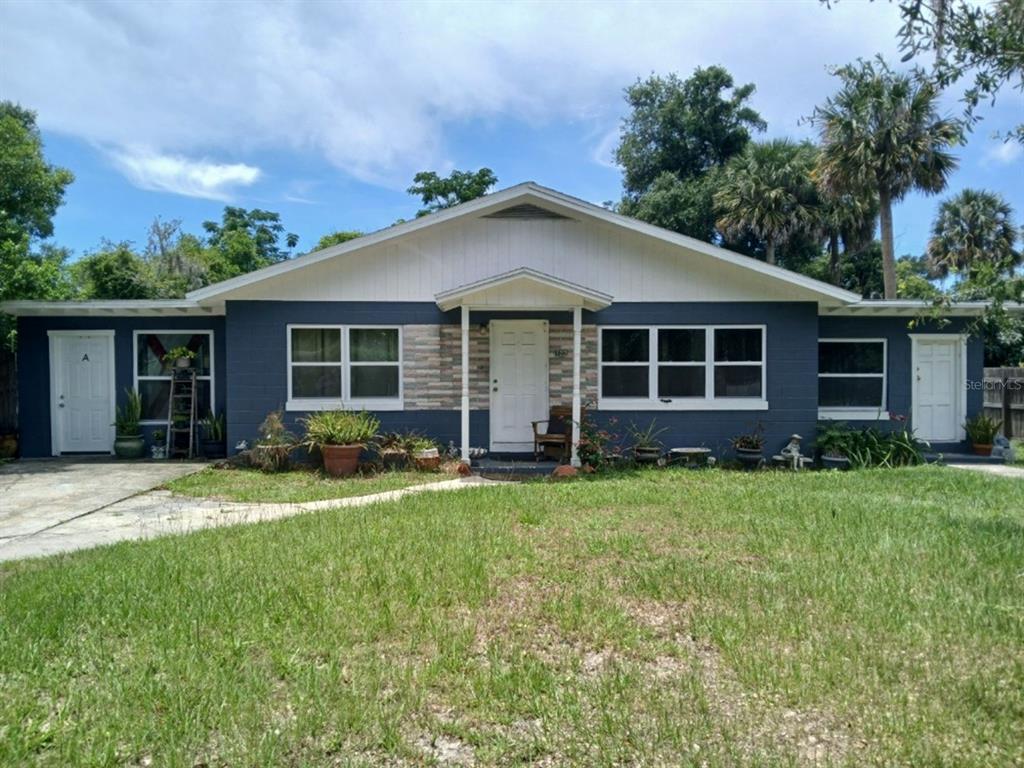 front view of a house with a yard