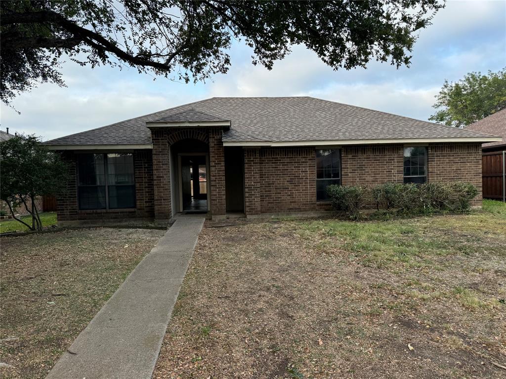 front view of a house with a yard