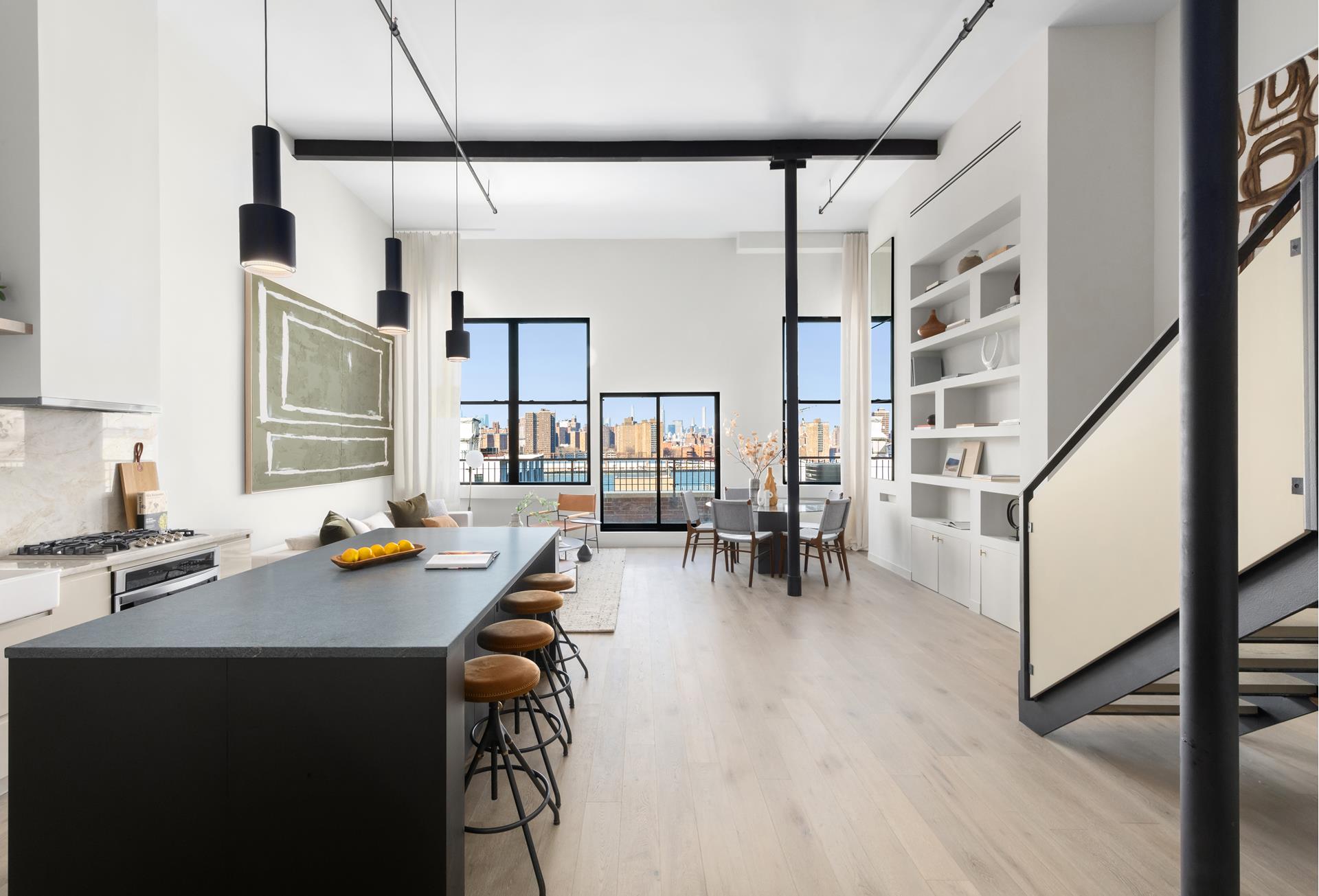 a view of a workspace with furniture and a kitchen