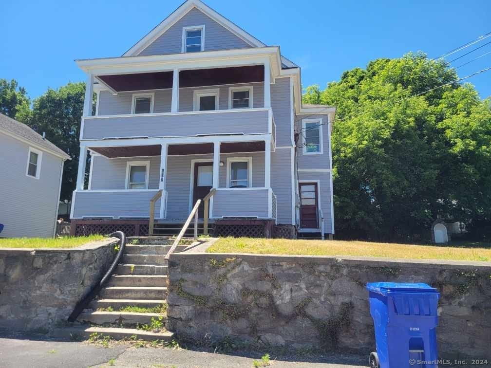 a front view of a house with swimming pool