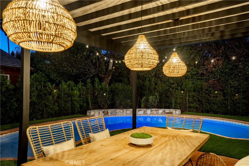 a view of a swimming pool with a patio