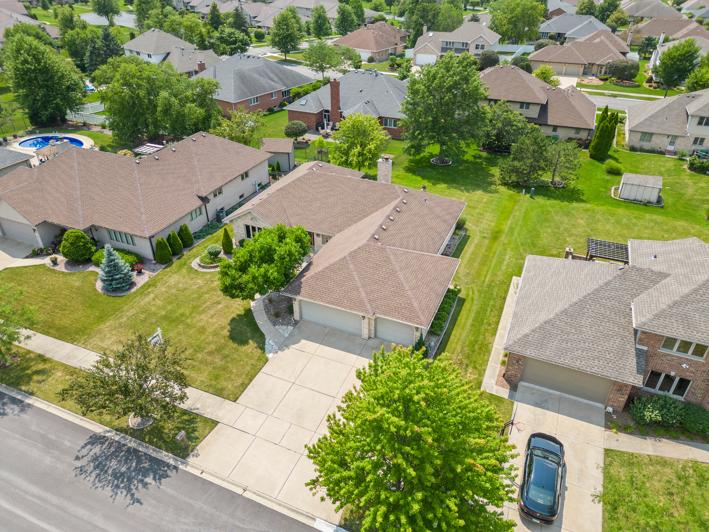 an aerial view of a house with a garden