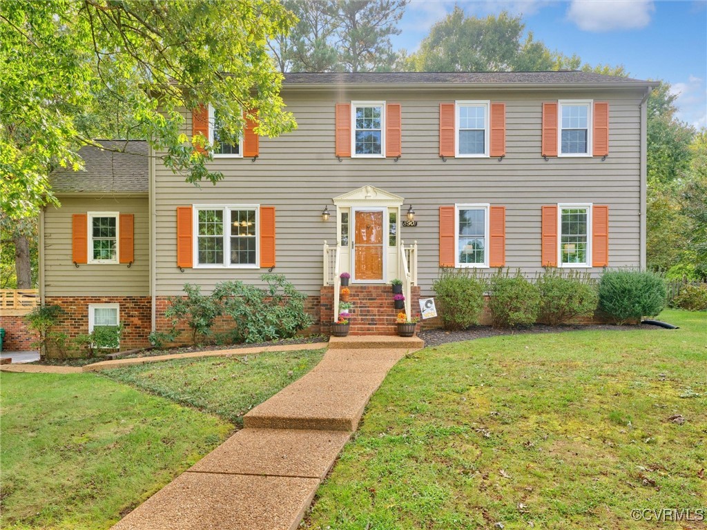 front view of a house with a yard