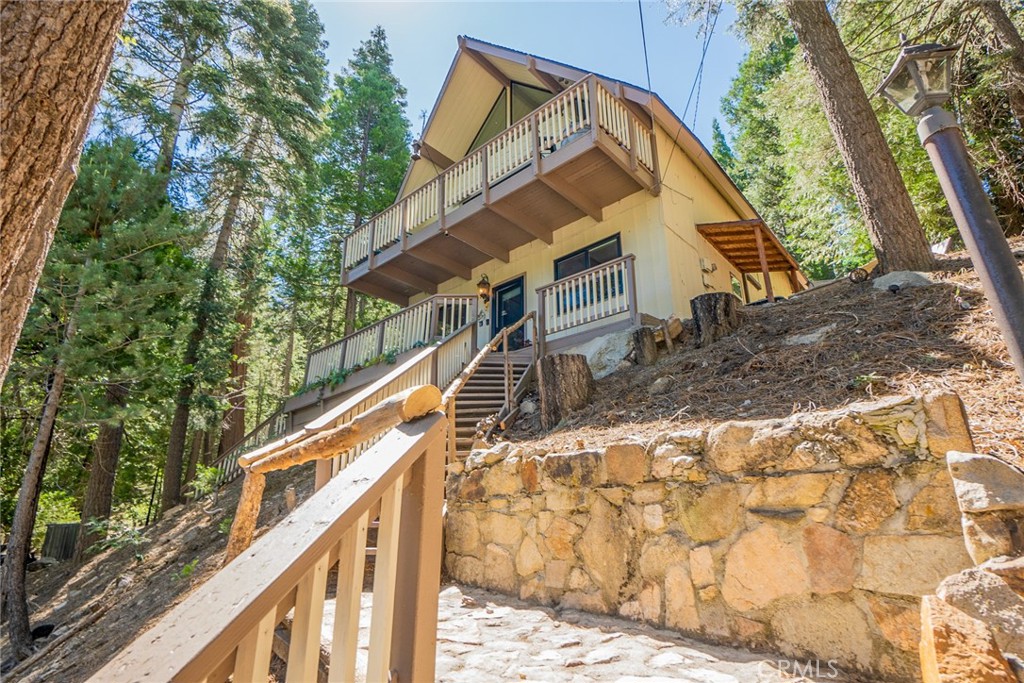 a view of house with a trees