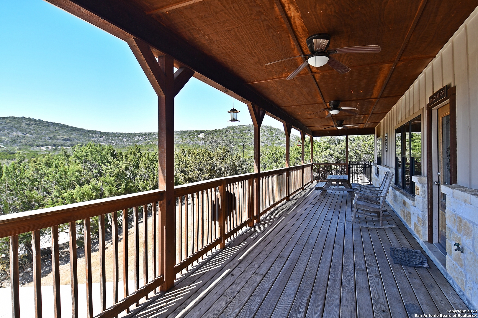 a view of porch with wooden floor