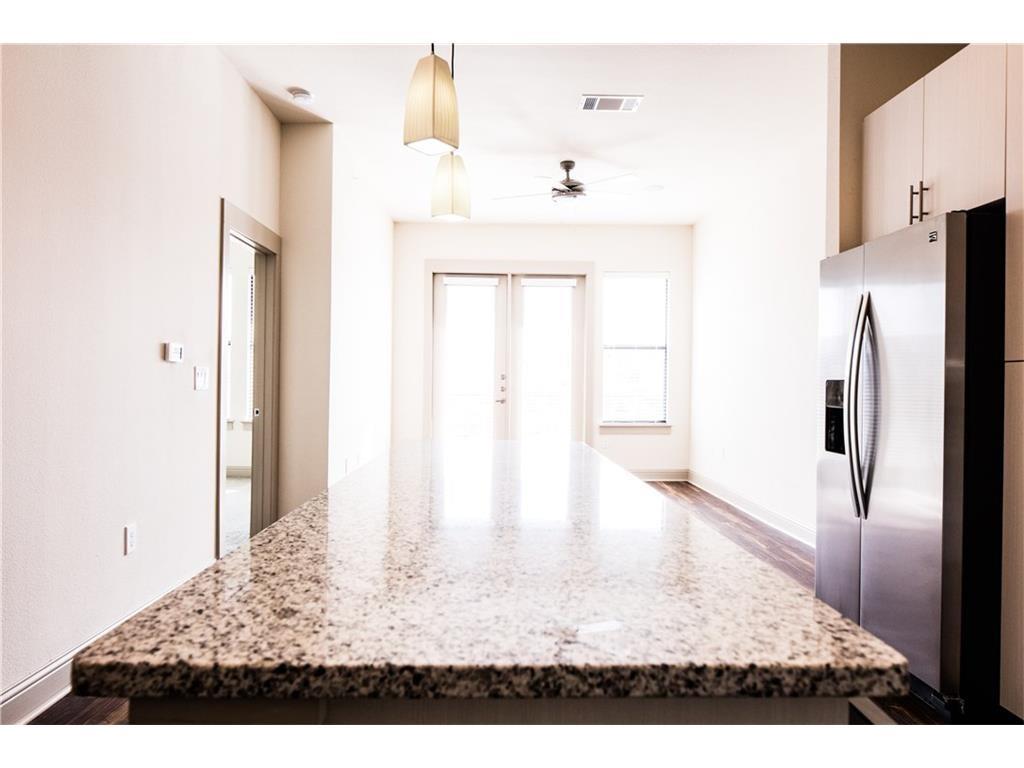 a view of kitchen with furniture and wooden floor