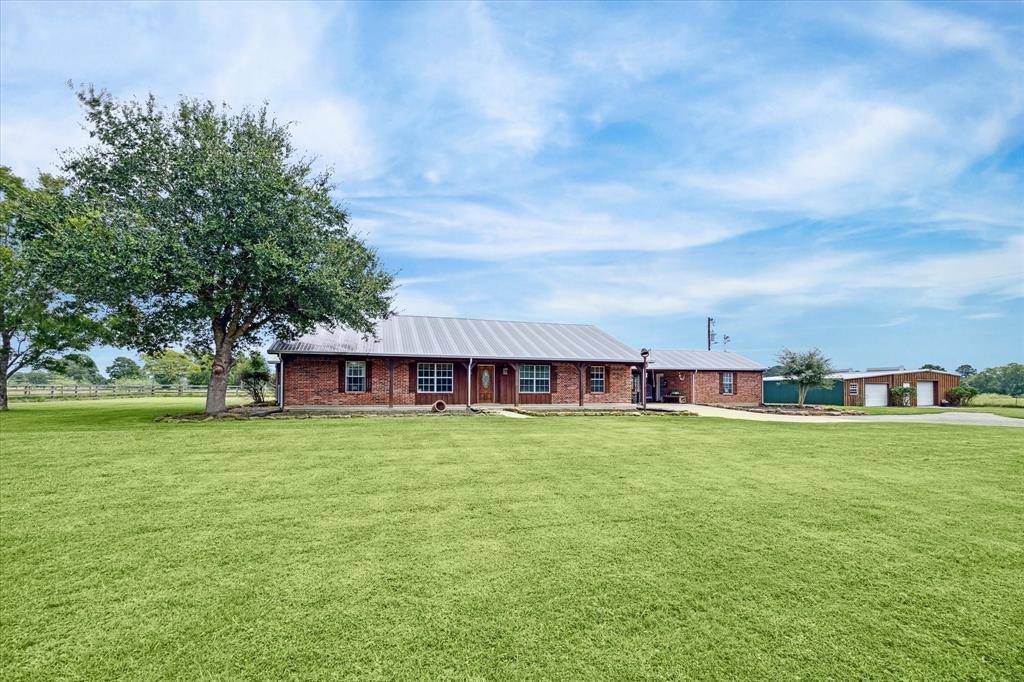 front view of a house with a big yard