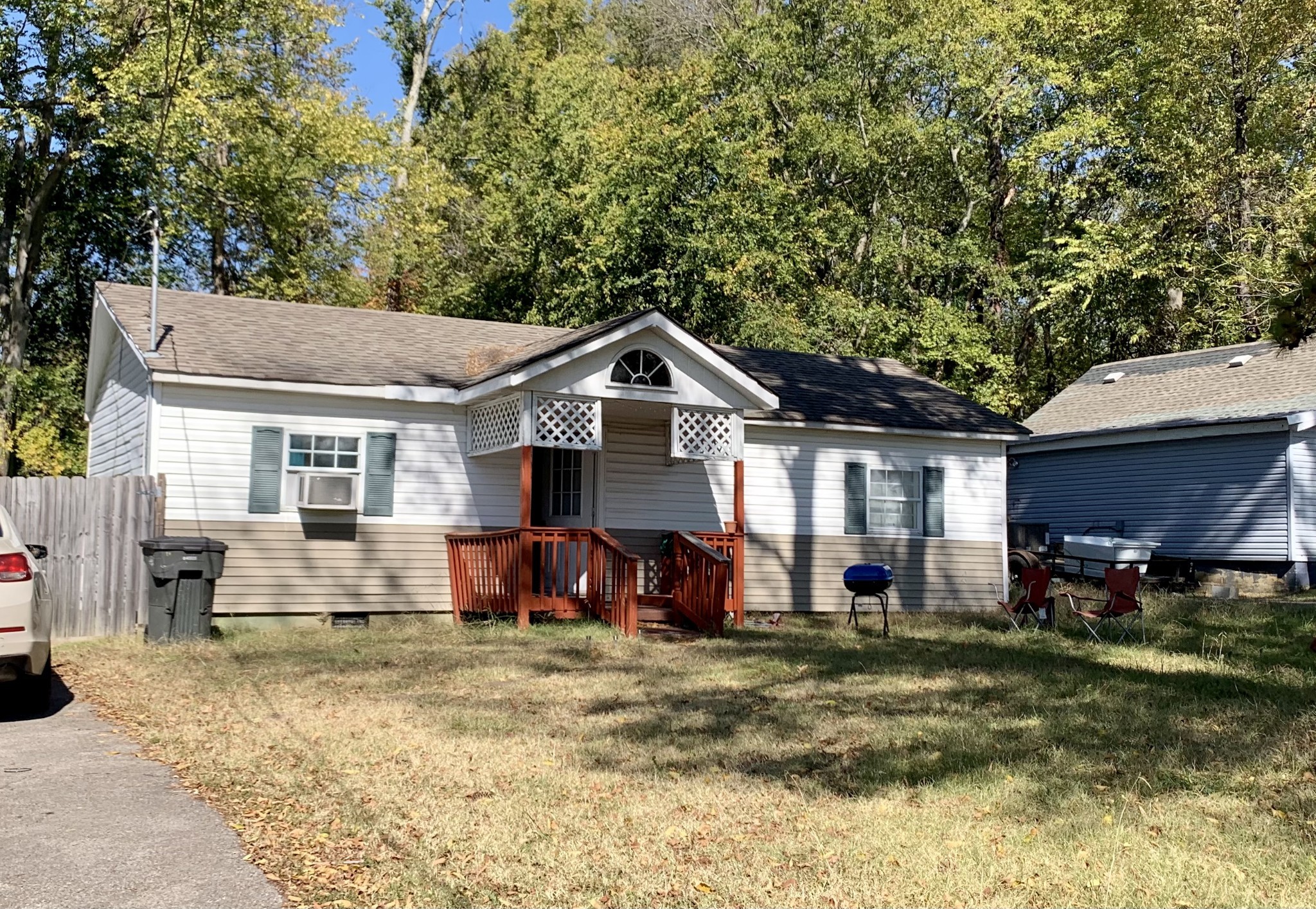 a view of a house with a yard and sitting area