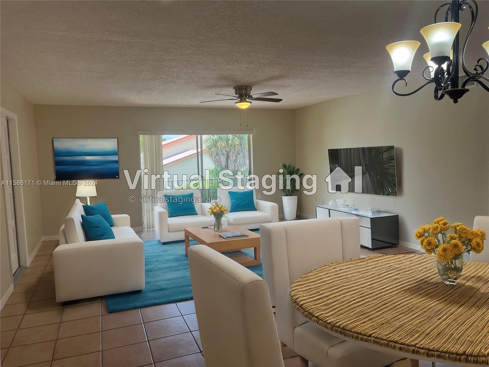 a living room with furniture a chandelier and a flat screen tv