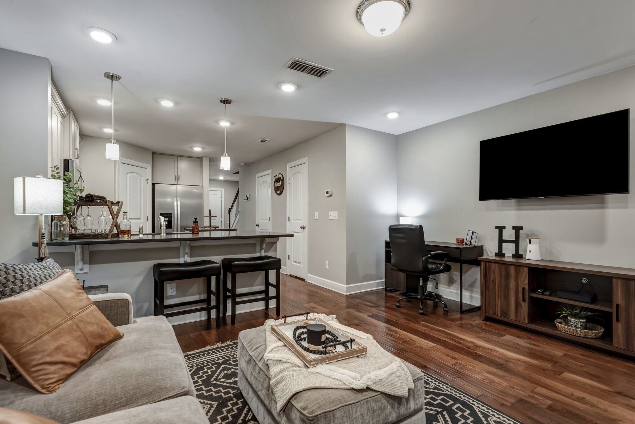 a living room with furniture and a flat screen tv