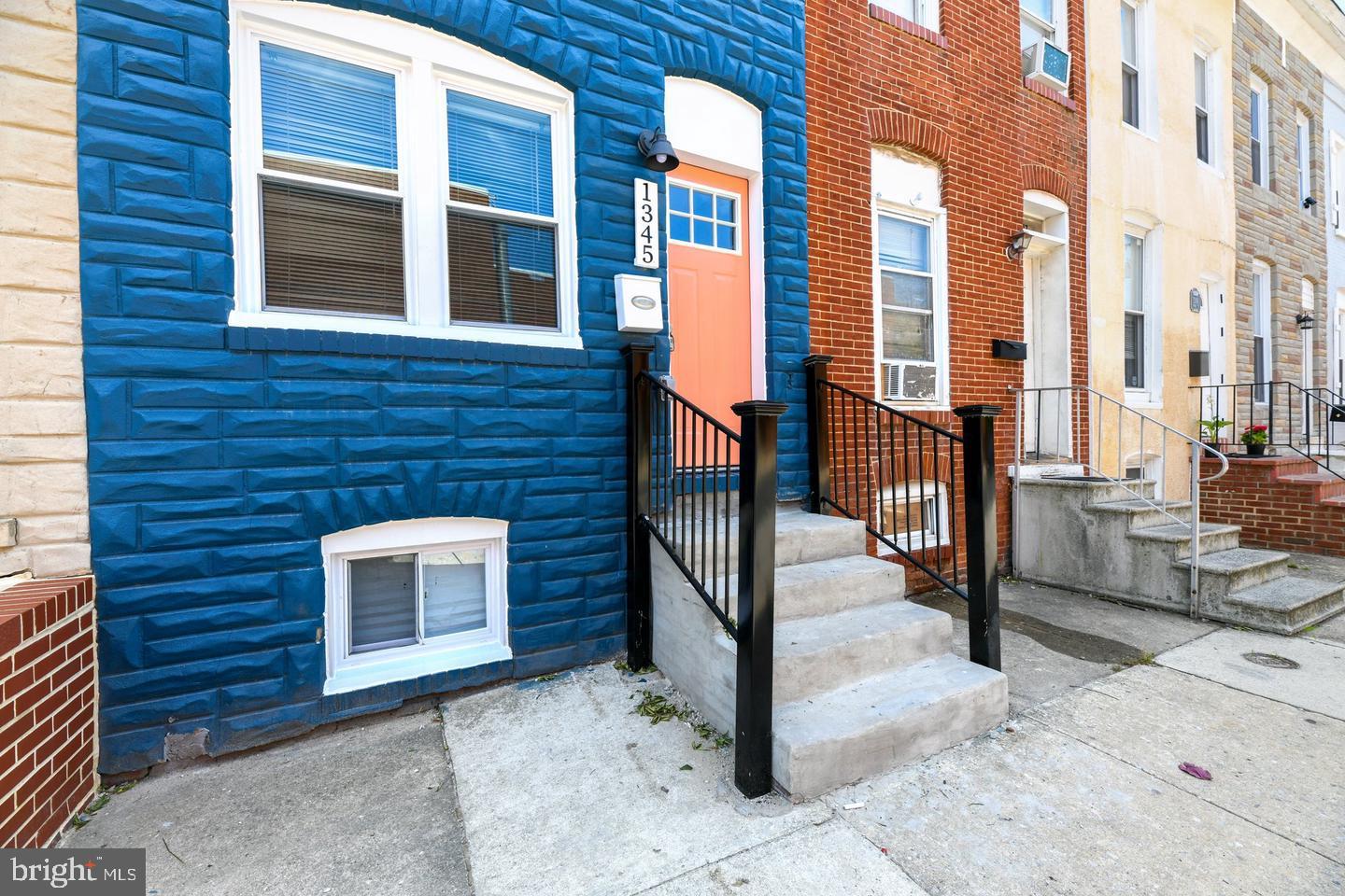 a view of a brick building next to a yard