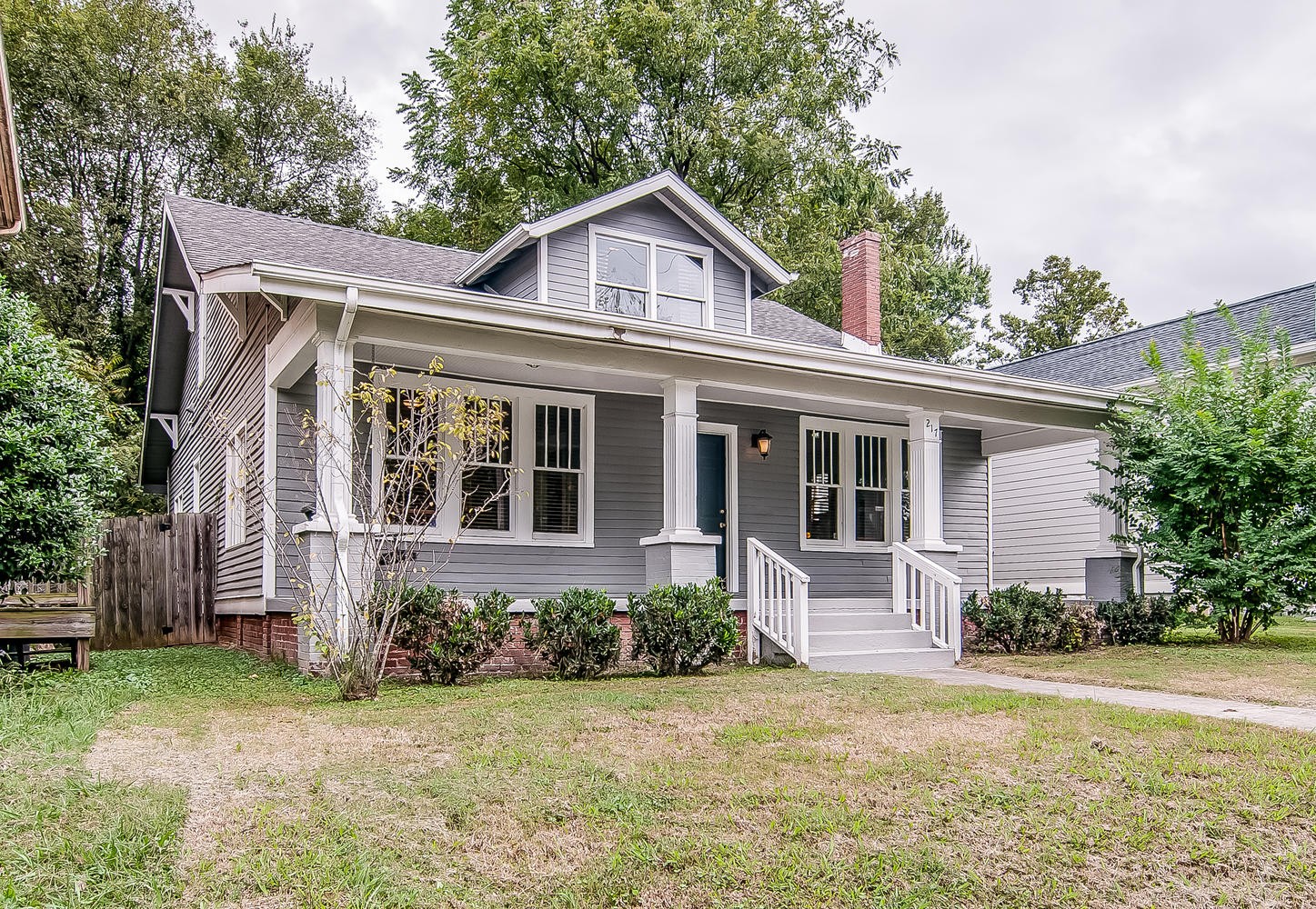 front view of a house with a yard