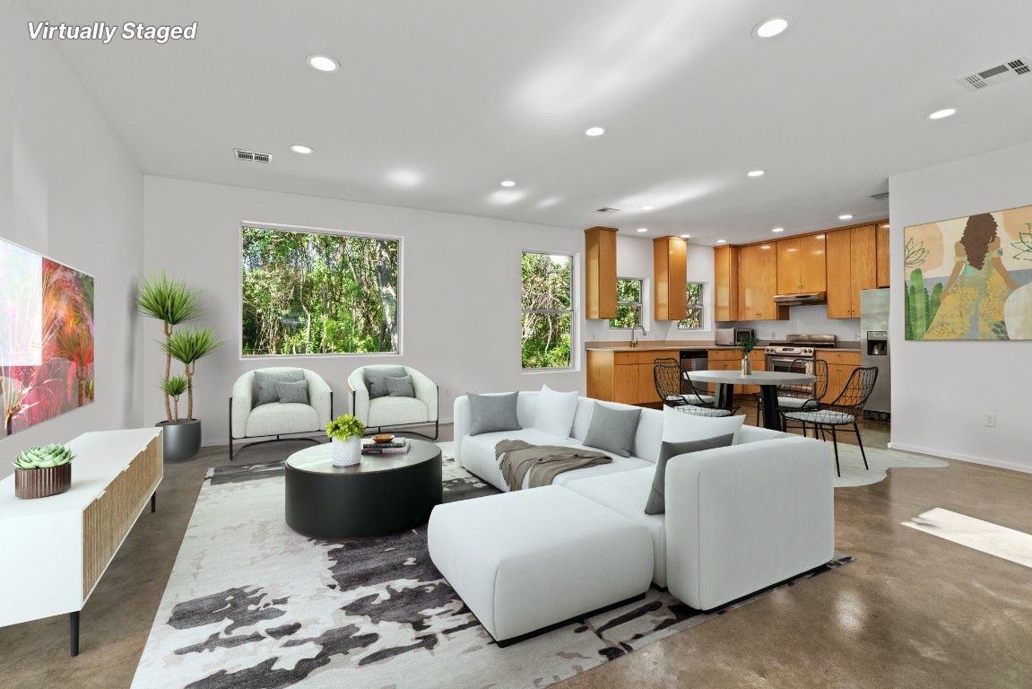 a living room with furniture and a large window