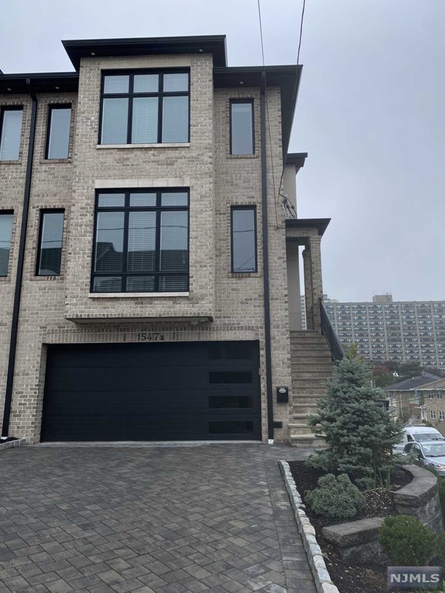 a front view of a house with a garage