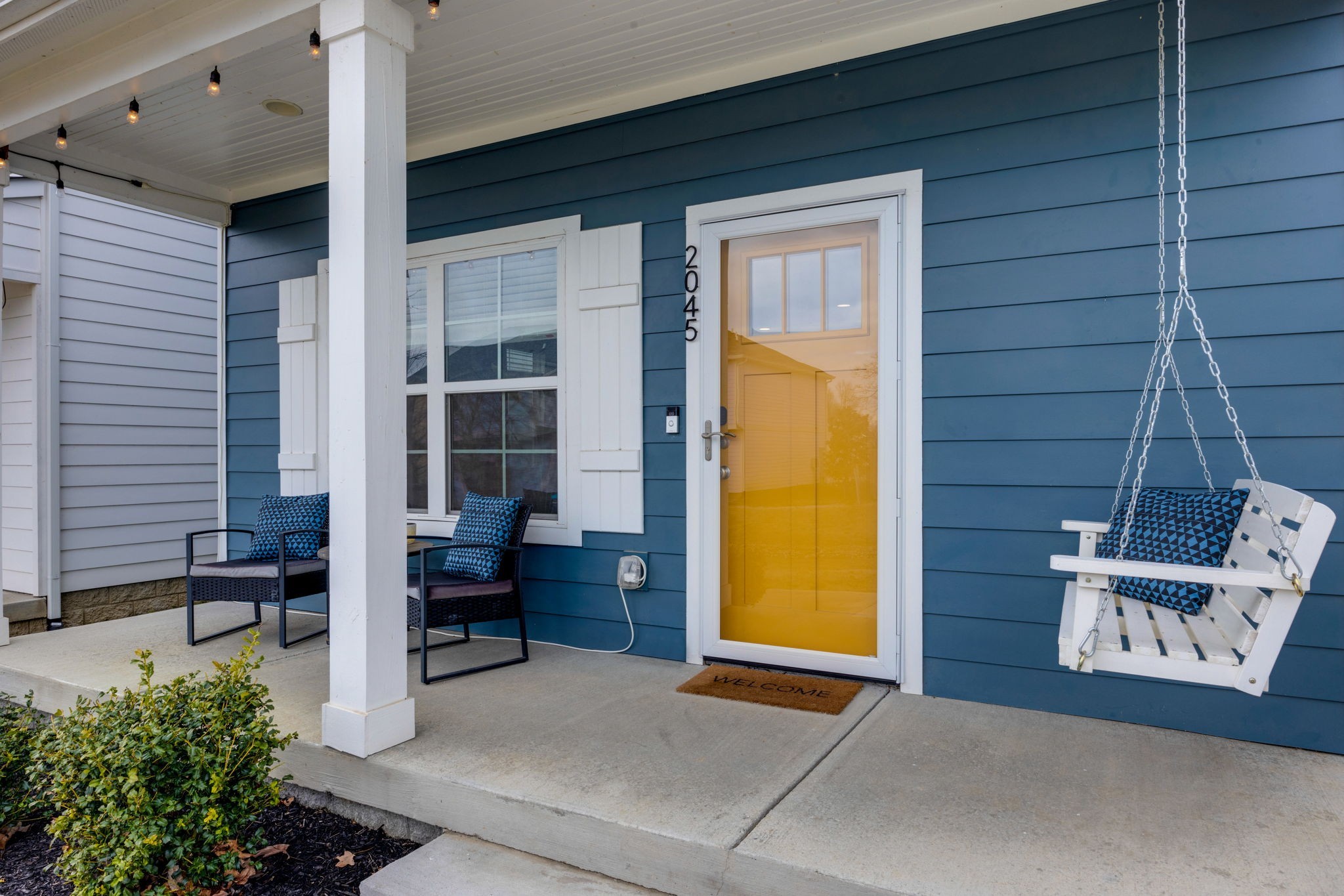 covered front porch with swing