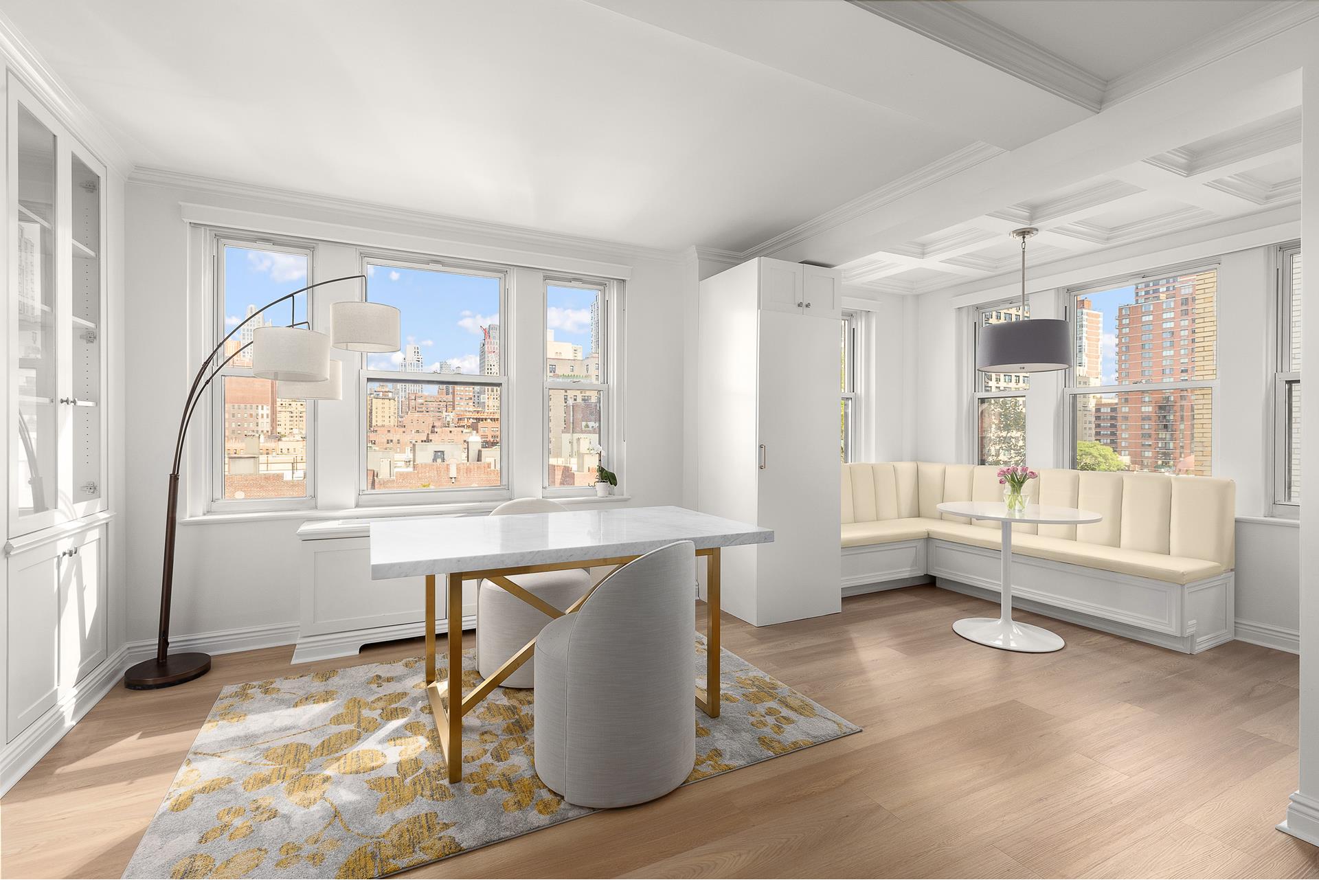 a large white kitchen with a large window